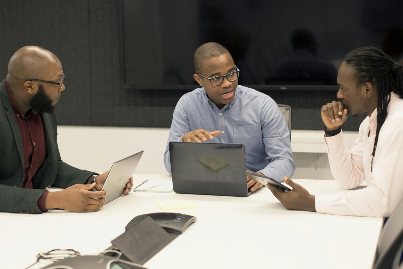 Directors reviewing company spending on their laptops