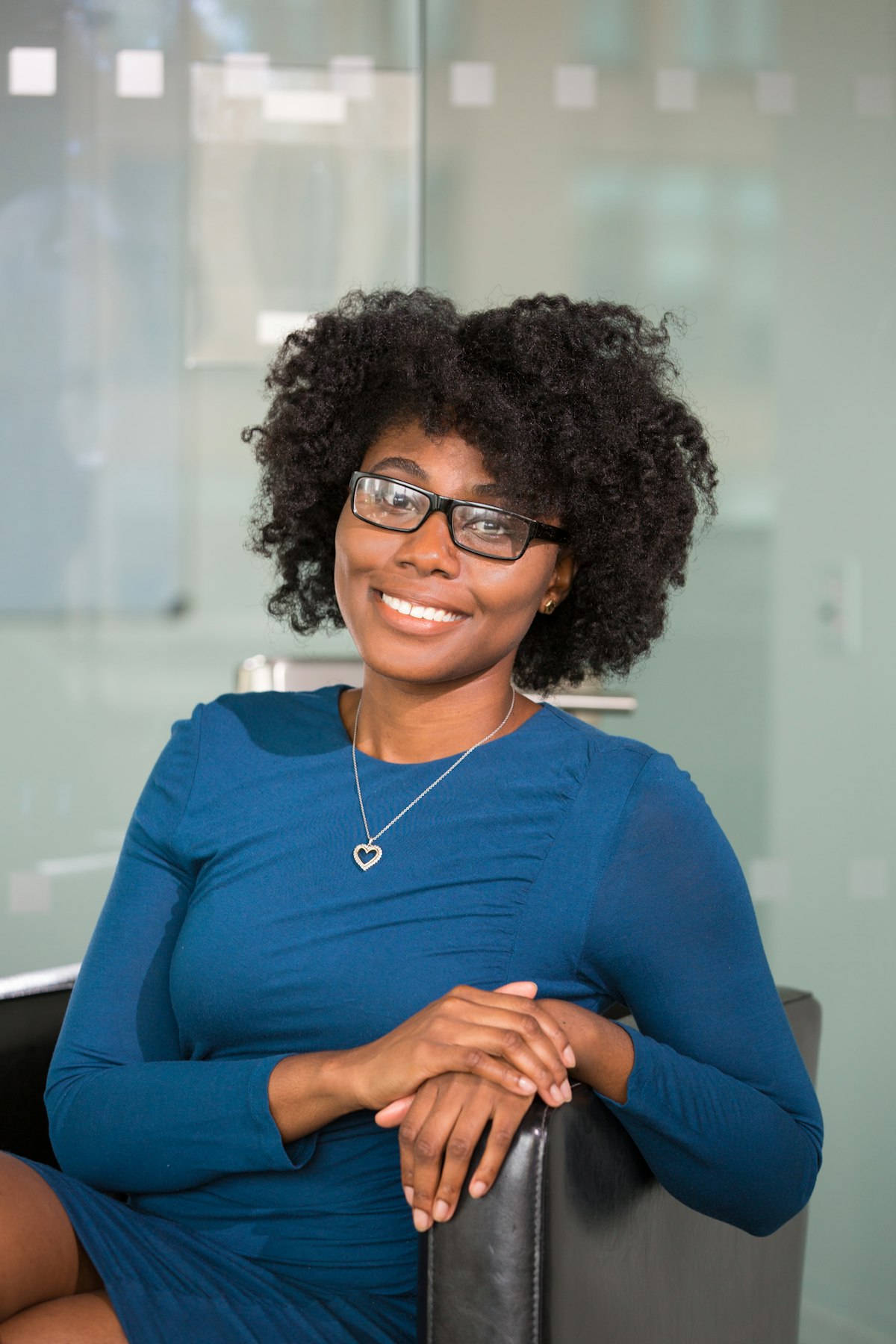 Approver smiling in her office