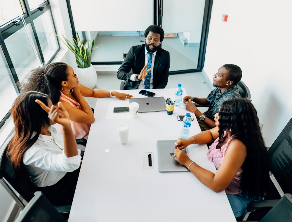 A team planning their budget around a meeting table