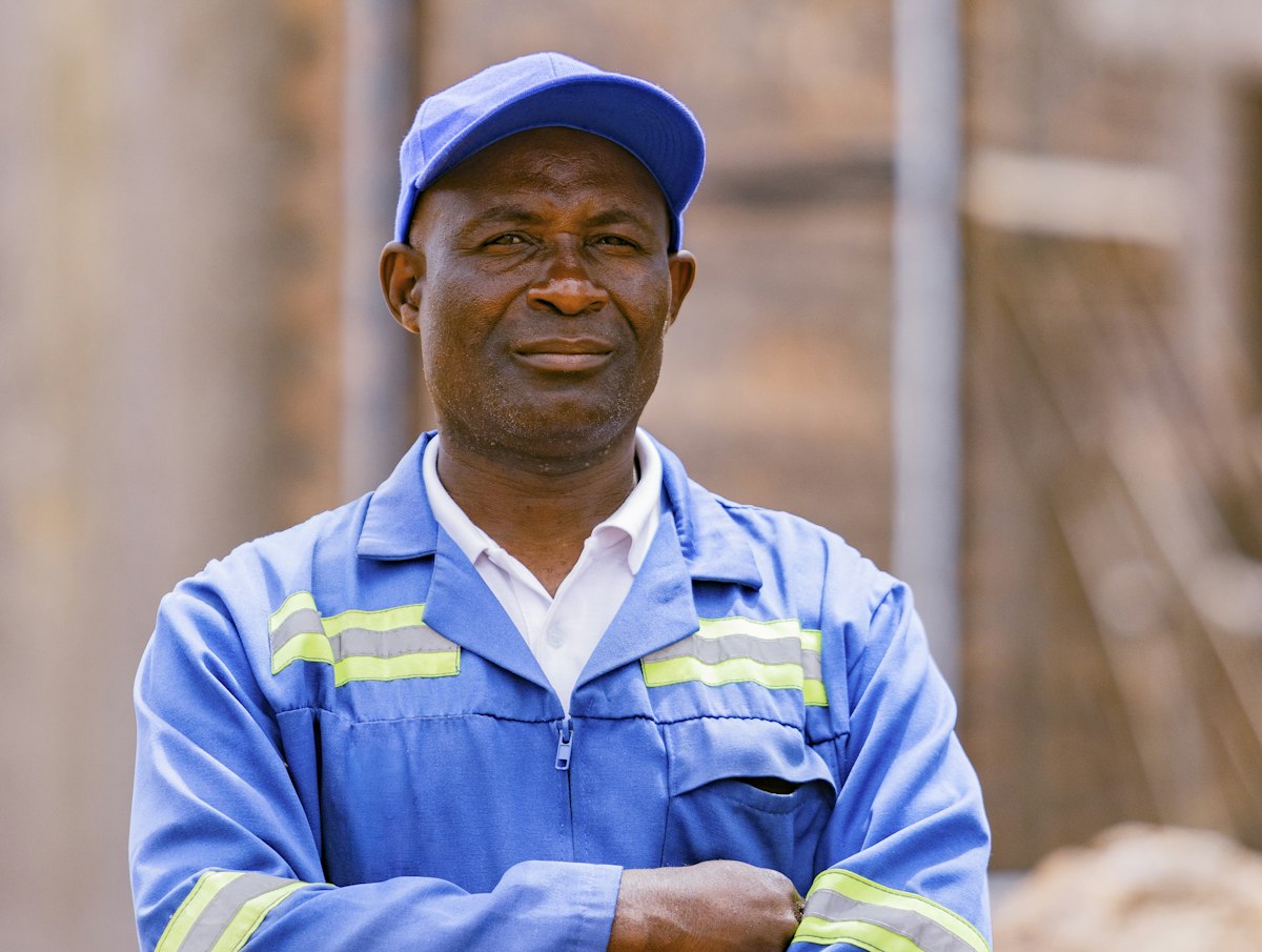 Site supervisor in a blue work uniform