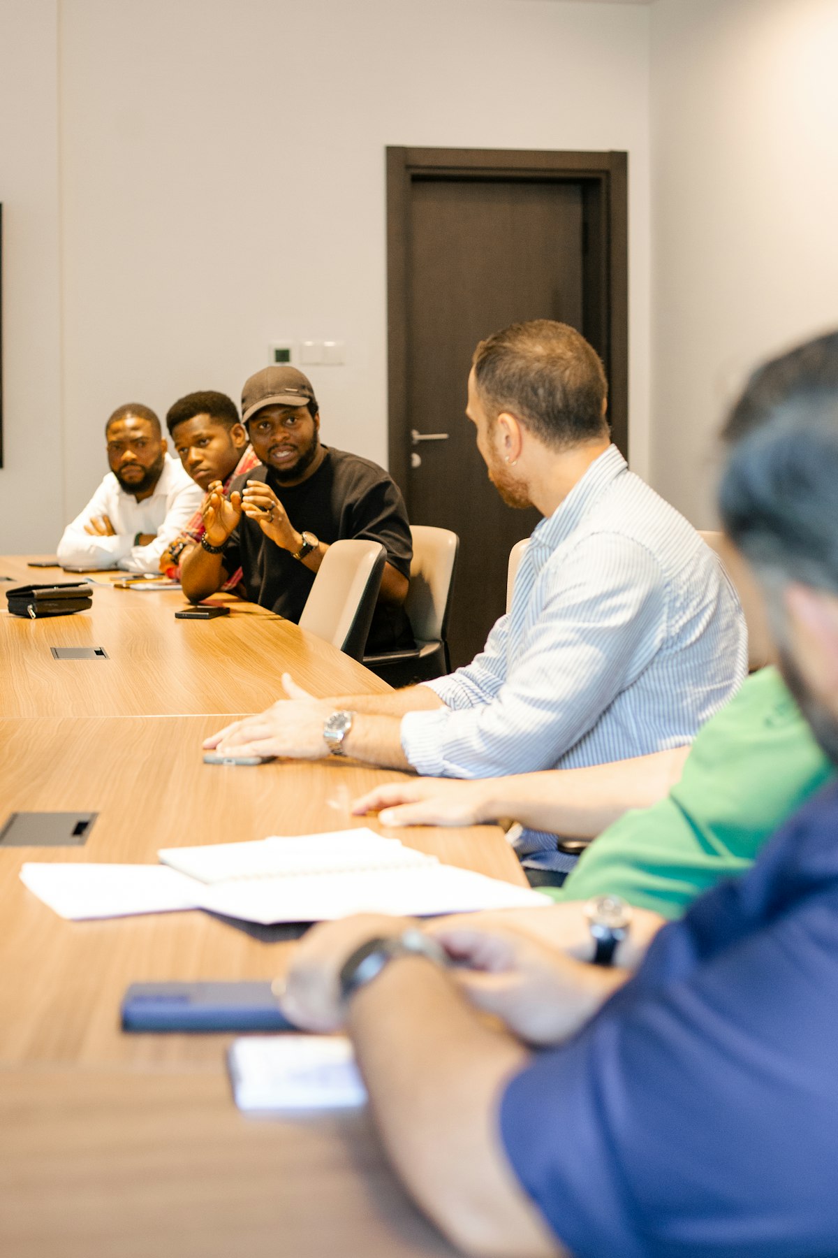 Team agreeing an estimate around a meeting table