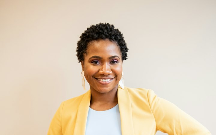 Business owner smiling with a tablet