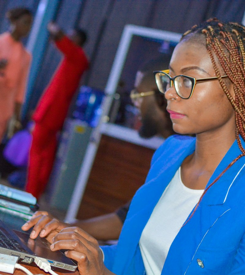 Finance officer reviewing figures on her laptop