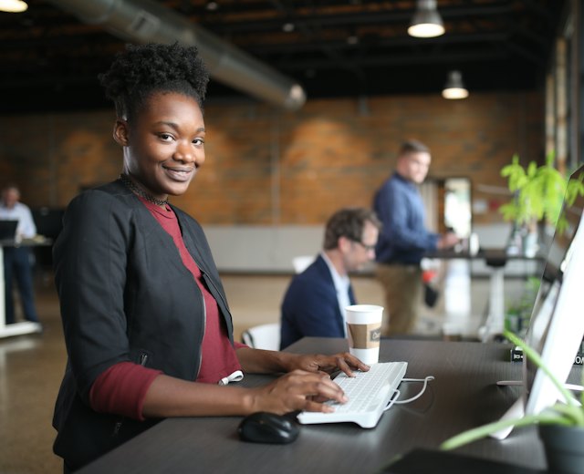 Accountant entering a supplier bill at her desk
