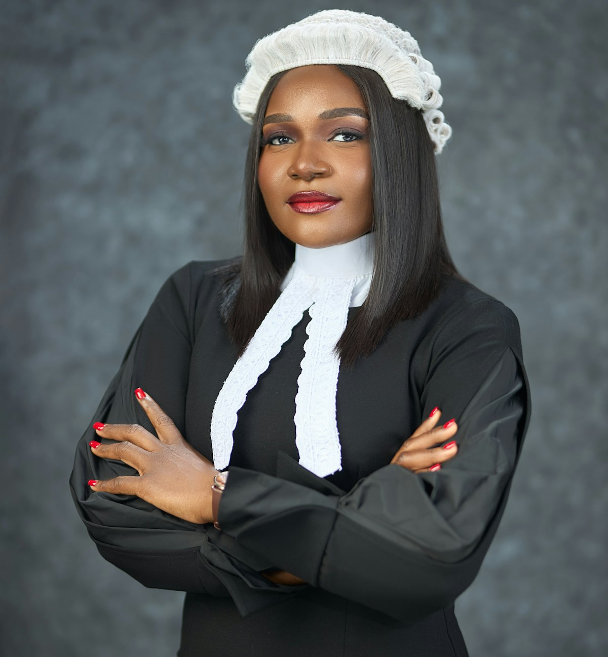 Advocate in court dress with arms crossed