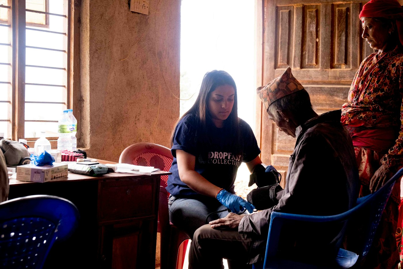 Health worker attending to a patient at a community clinic