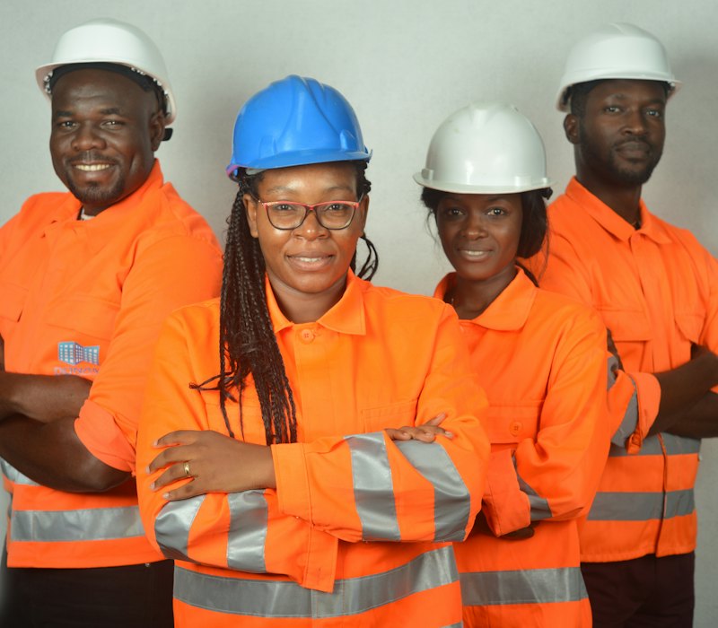 Field crew in high-visibility workwear smiling