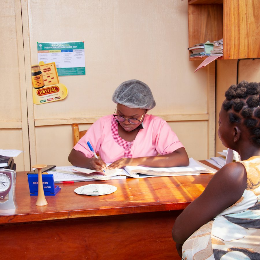 Office administrator writing up paper petty cash slips