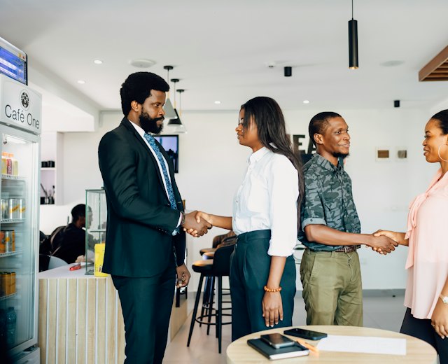 Director shaking hands with a client