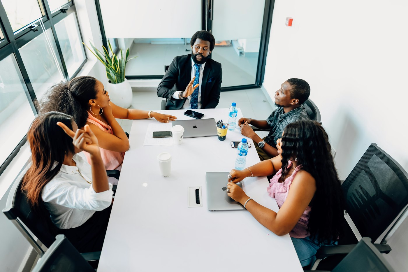 Consulting team meeting around a boardroom table