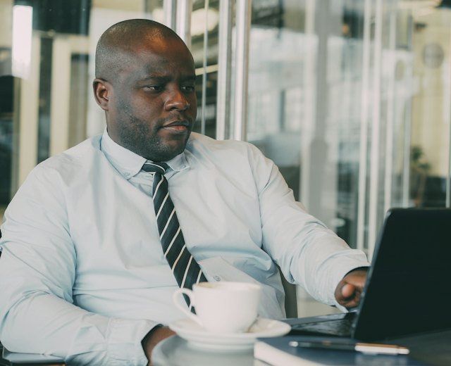 Finance manager working on his laptop