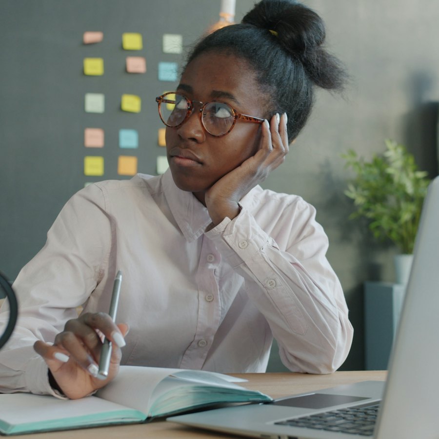 Staff member waiting on a purchase request at her desk