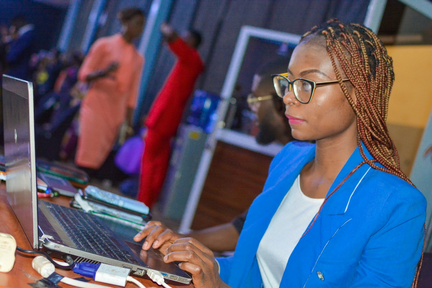 Accountant in a blue blazer working on her laptop