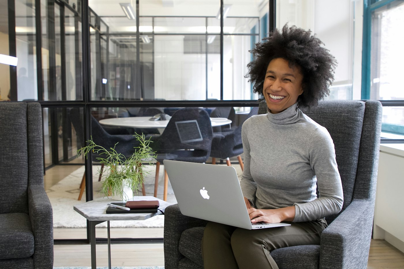 Business owner smiling while working on her laptop