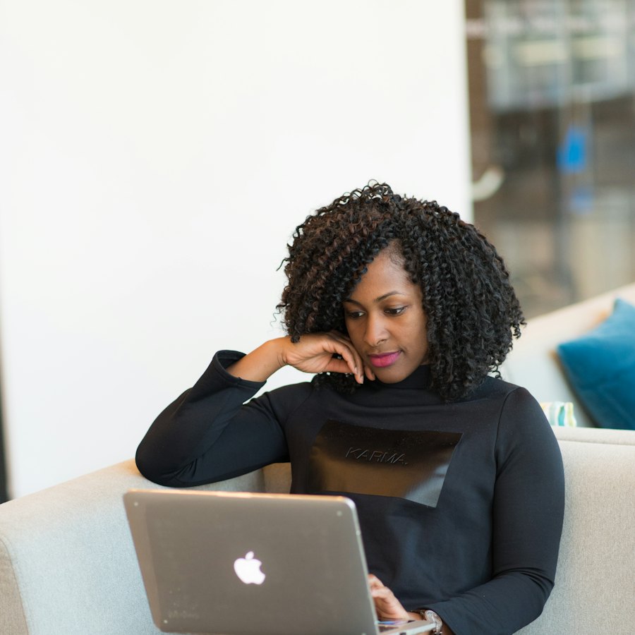 Business owner frustrated while checking payments on her laptop